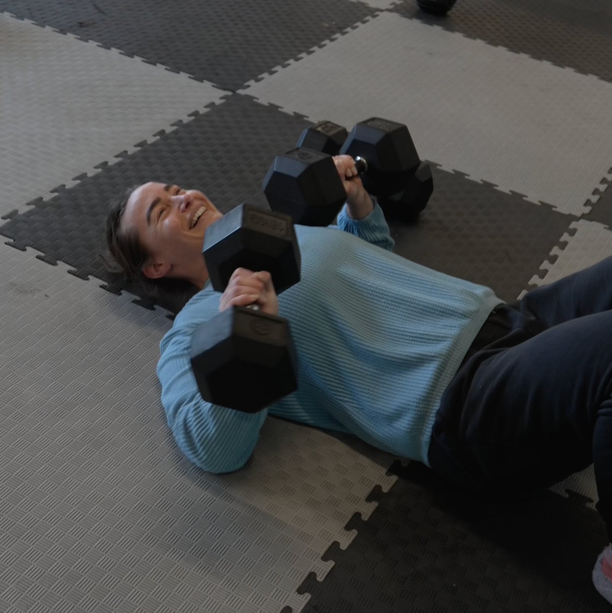 Client training with dumbbells